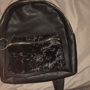 Faux leather & Velvet backpack . Nice size
